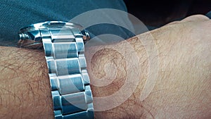 Modern steel watch on hand. Luxury fashion, watch on wrist, Ellegance guy