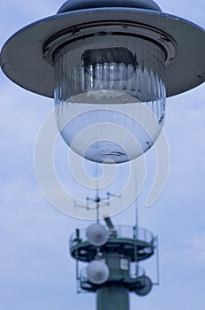 A modern street lamp against a blue sky