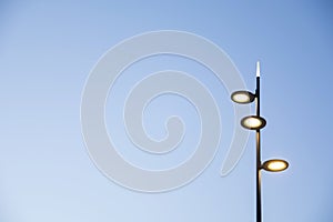 Street lamp on the blue sky as a background in sunset