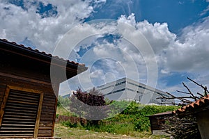 Modern structure manufacturing company building with sky