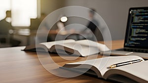 Modern Study and Work Environment with Open Books and Laptop