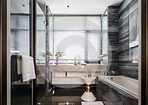 Modern style bathroom with bathtub and washbasin big window