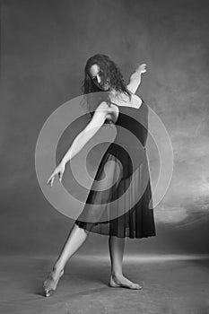 Modern style dancer posing on grey background