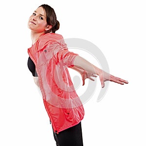 Modern style dancer posing with hands on back in studio backgrou