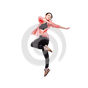 Modern style dancer posing hodling leg on studio white background