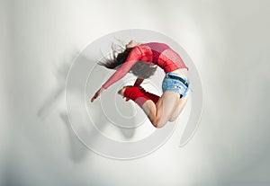 Modern style dancer posing on white background