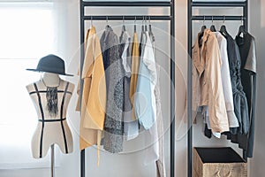 Modern style wardrobe with clothes