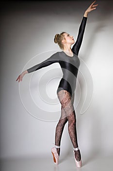 Modern style woman ballet dancer full length