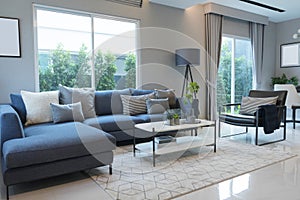 Modern and stylish living room, blue sofa and grey pillow with coffee table