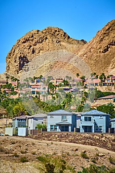 Modern Suburban Homes with Desert Mountain Backdrop Eye-Level View photo