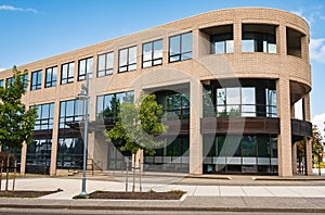 Modern suburban low rise office building. Architectural Exterior of Commerical Office Building Facade, sunny summer day