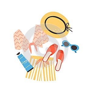 Modern summer composition with beachwear, sunglasses and sunscreen. Elegant stylish seasonal clothes and sunblock cream