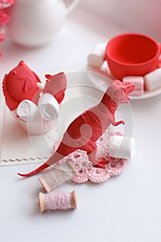 Modern surreal tea party with living coral color toy, sweetness, wonderland morning on windowsiil, unusual still life background