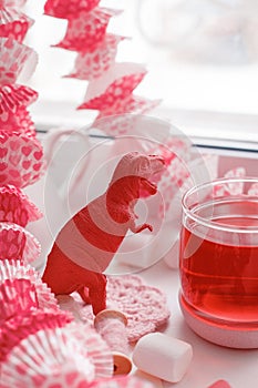 Modern surreal tea party with living coral color toy, sweetness, wonderland morning on windowsiil, unusual still life background