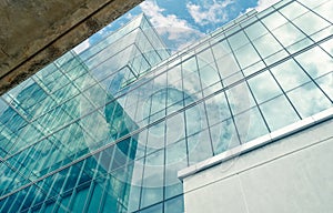 Modern sustainable glass office building. Exterior view of corporate headquarters glass building architecture. Energy-efficient