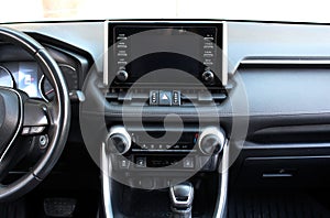 Modern SUV dashboard. Screen multimedia system. Interior of a modern luxury car. Control panel in a modern SUV.
