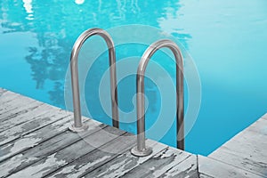 Modern swimming pool with ladder at