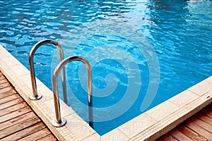 Modern swimming pool with step ladder