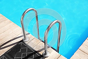 Modern swimming pool with step ladder