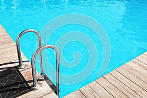 Modern swimming pool with step ladder