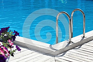 Modern swimming pool with step ladder