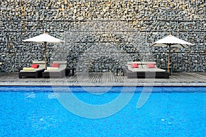 Modern Swimming Pool with stone wall