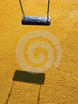 Modern swing teeter-totter in a playground