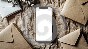 Modern technologies and old traditions. Phone mockup. A white-screen phone is on the table next to a stack of mail envelopes. Top