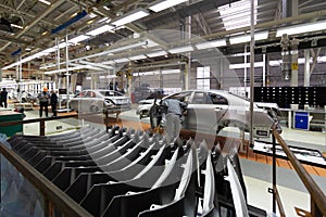Workers assemble a vehicle body. process of welding cars. Modern Assembly of cars at the plant. automated build process photo