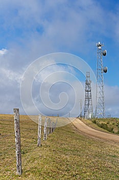 Modern Technology Communications Tower Juxtaposed With Undulating Farming Country