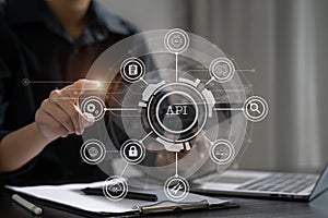 Modern technology and networking concept, woman using laptop, tablet and smartphone with virtual screen API icon Software