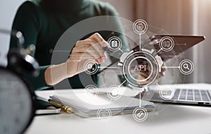 Modern technology and networking concept, woman using laptop, tablet and smartphone with virtual screen API icon Software