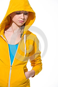 Modern teenager girl in sweater with draped hood