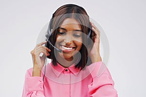 Modern telecommunications in business. Studio shot of an attractive young female customer service representative wearing