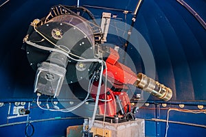 Modern telescope with computerized automatic control under dome of observatory