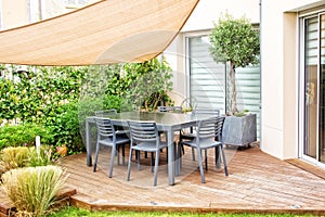 Modern terrace with dining table and chairs