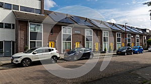 Modern Terraced houses with solar panels on the roof of rental houses. Photovoltaic panels on the roof.