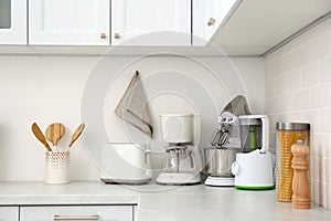 Modern toaster and other home appliances on countertop in kitchen