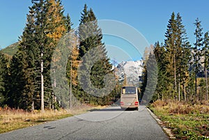 The modern tourist bus on mountain road