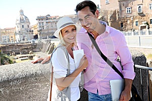 Modern tourists visiting Foro Traiano on sunny day