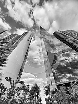 Modern tower buildings architecture bottom view on cloudy sky in city of Sunny Isles, USA