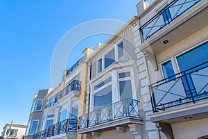 Modern townhouses with balconies and picture windows in a low angle view at San Francisco, CA