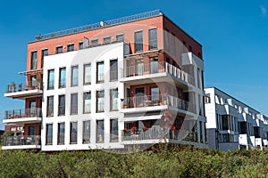 Modern townhouses under a blue sky