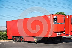 Modern trailer of a forwarding company, parked outdoors during daylight