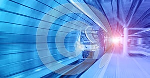 Modern train on in the illuminated tunnel rushes at high speed with motion blur. Format banner header size, place for text