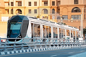 modern tram with an automated control system runs on rails in the city center. The concept of eco-friendly public transport of