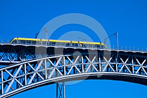 Modern tram on a steel bridge