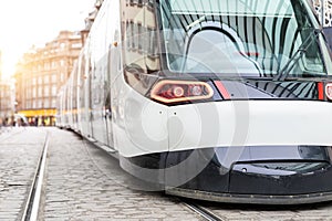 Modern tram streetcar at Kleber Central transport stop hub at Homme de Fer square in historic old town Strasbourg street