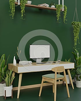Modern trendy workspace with a computer on a minimal wooden desk against the green wall