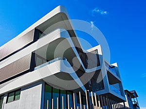 Modern Tri-Level Apartment Building and Blue Sky